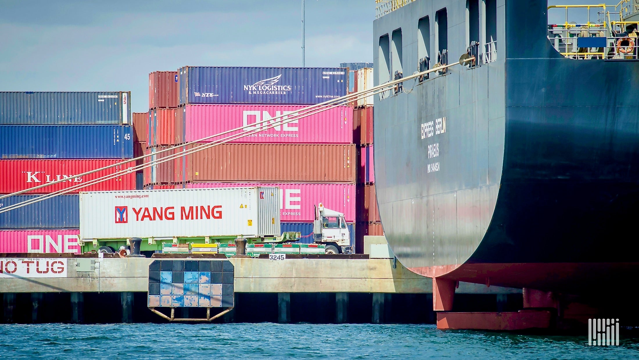 Shipping containers being unloaded from a ship at the Port of Long Beach.