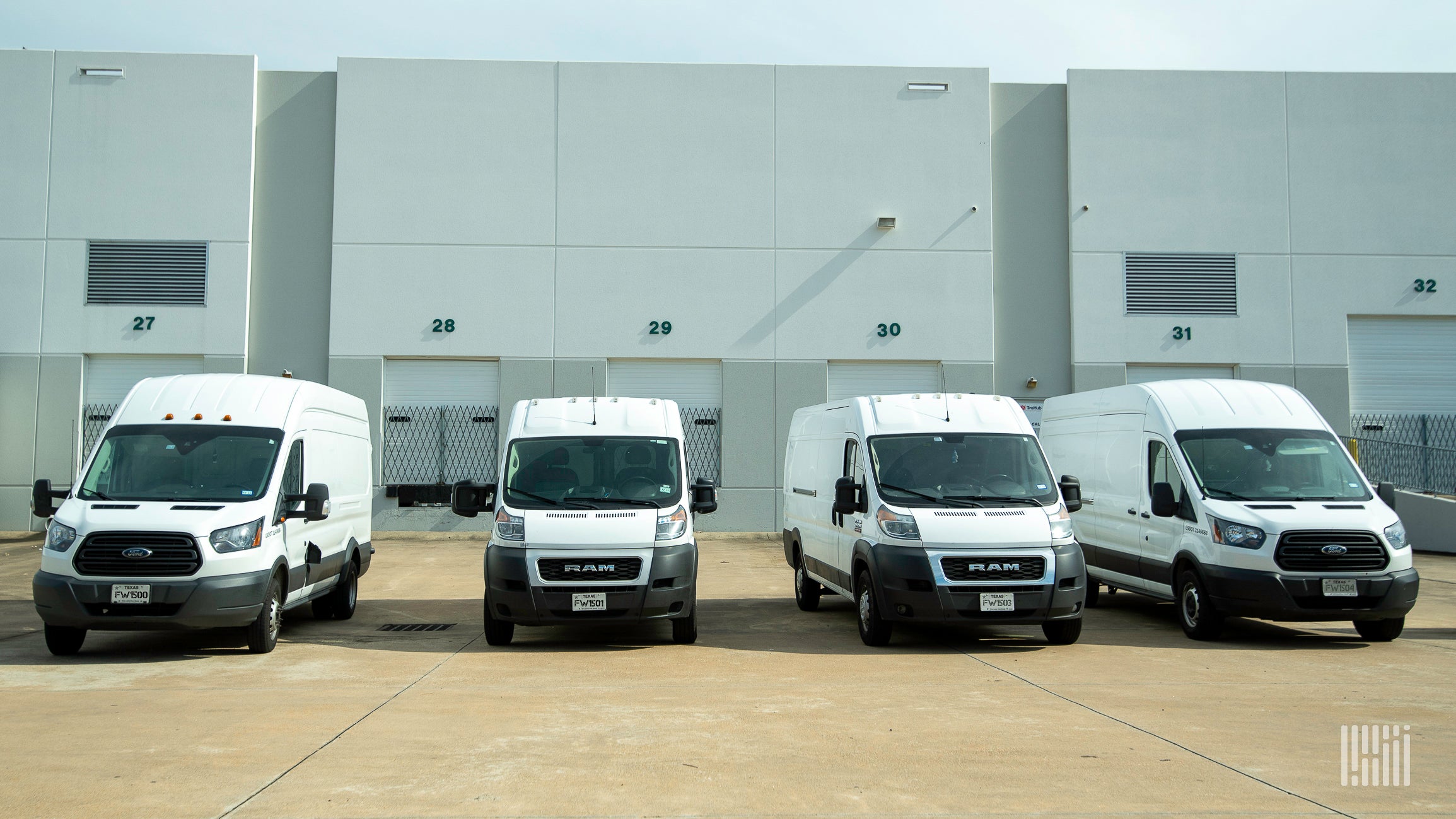 Vans parked at a warehouse