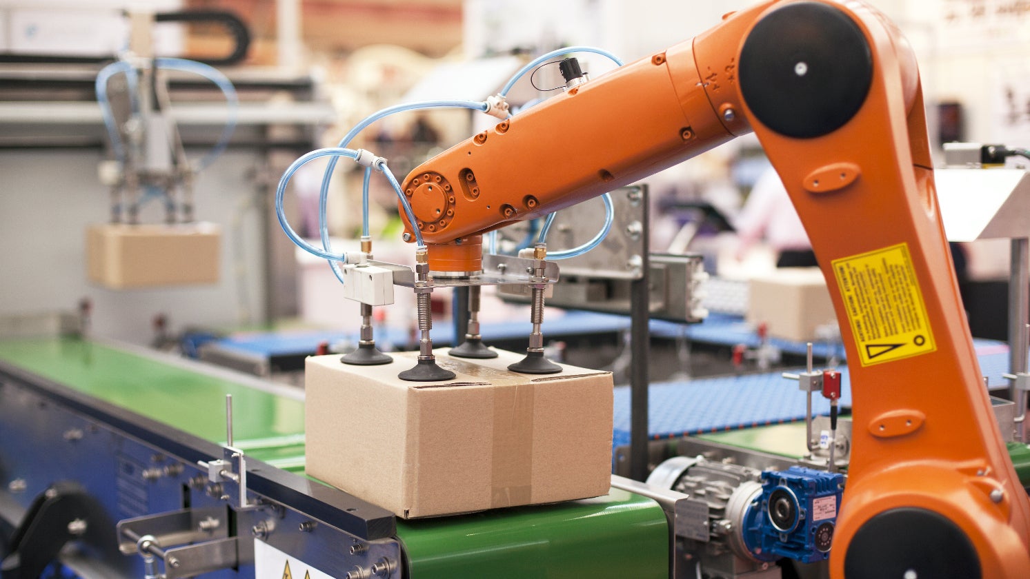 Robot arm lifting a box