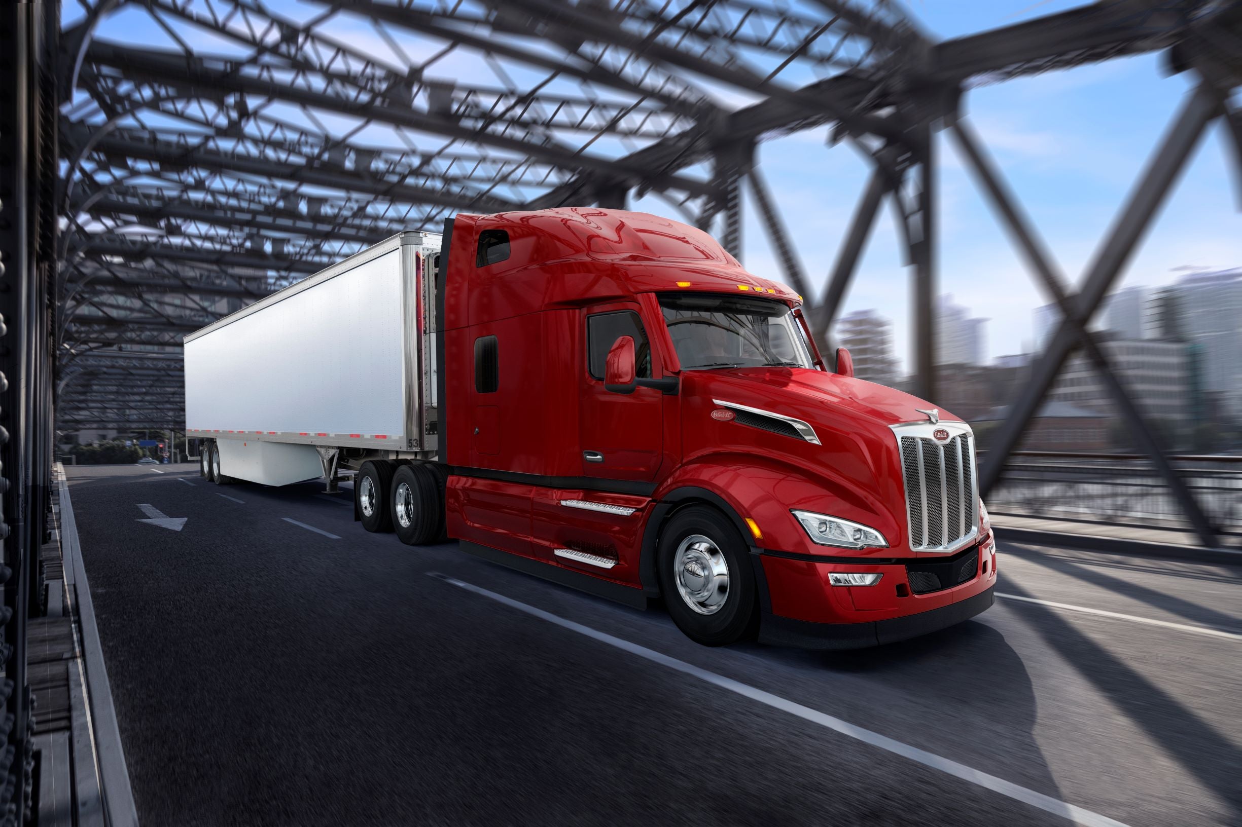 Red Peterbilt 579 crossing bridge