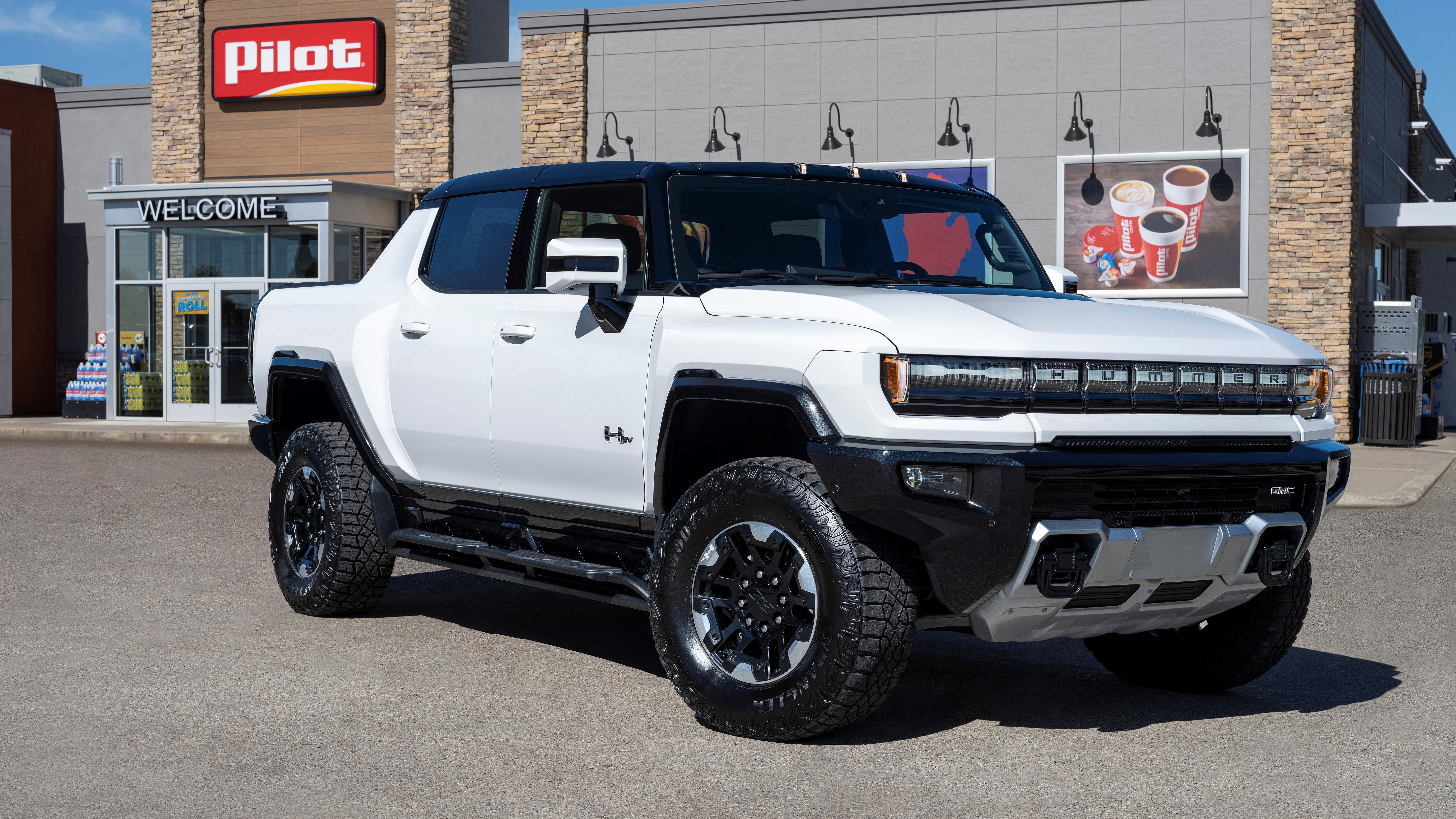 White GMC Hummer in front of Pilot truck stop