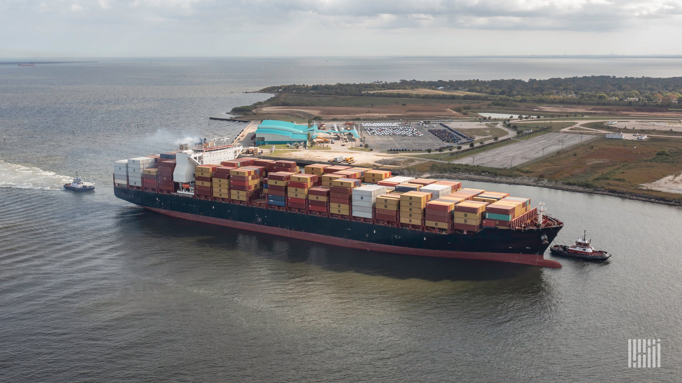 A container ship is traveling into a port.