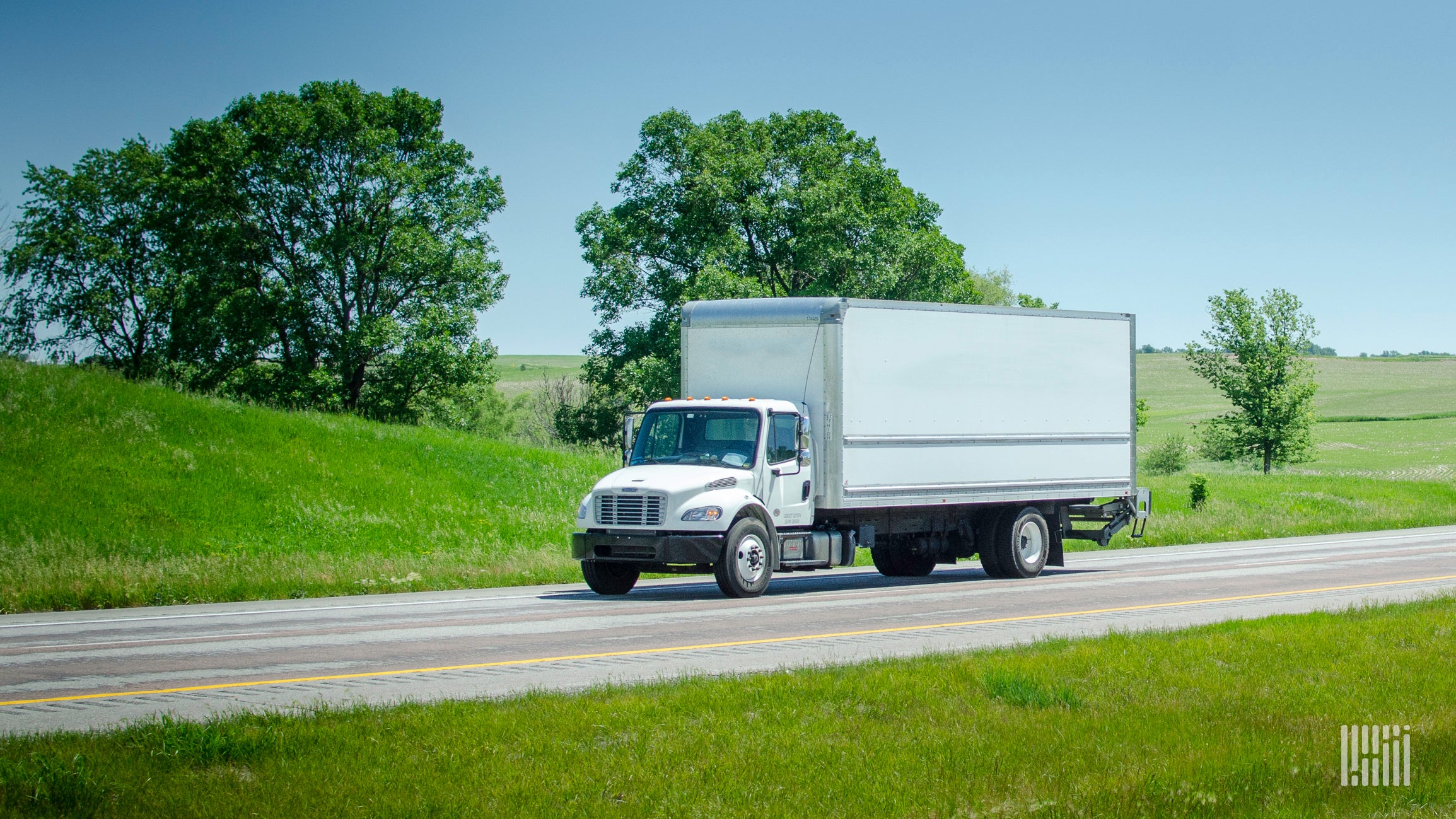 white box truck on roadway