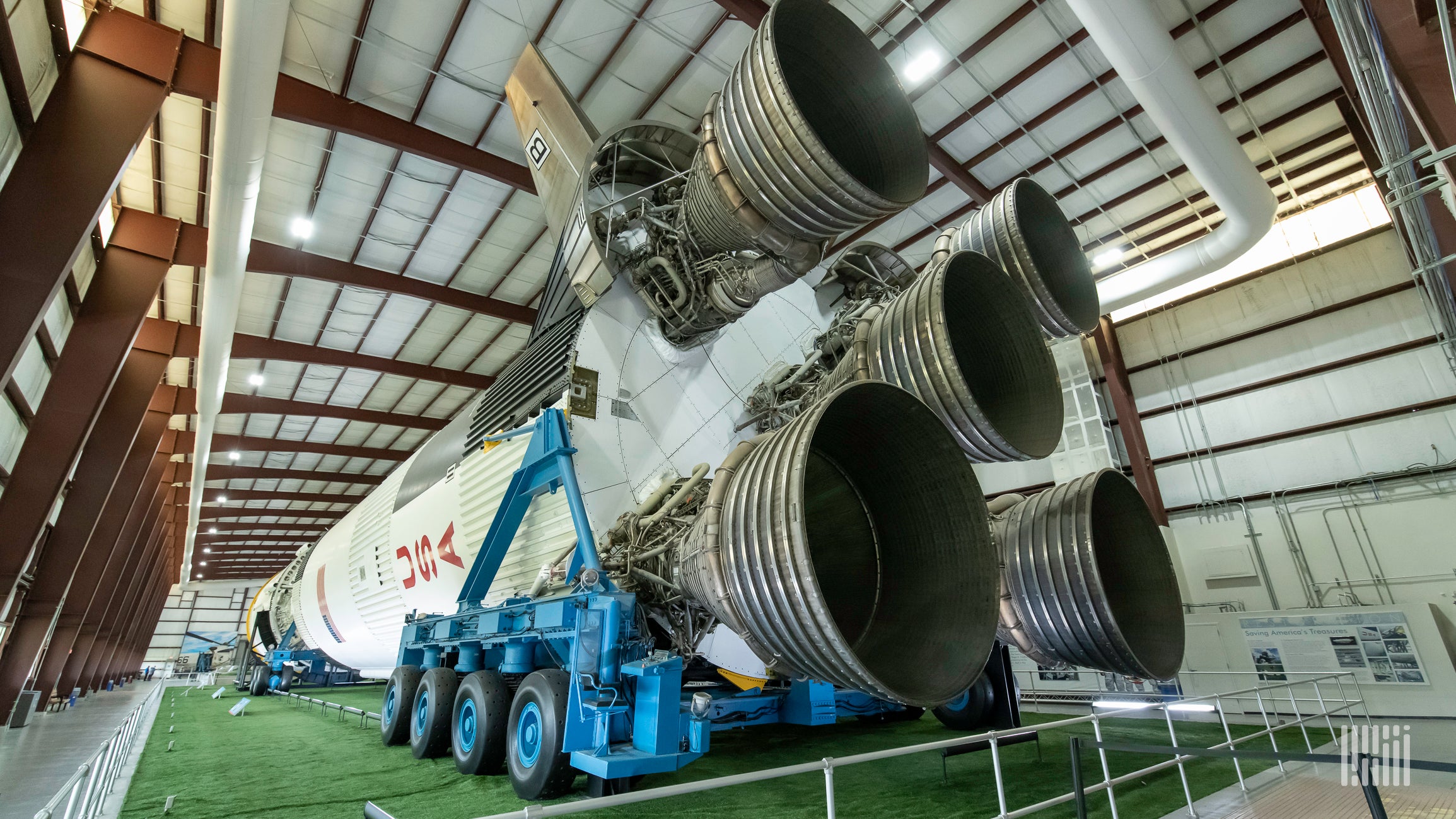 A space rocket sits horizontally in the Johnson Space Center in Texas.