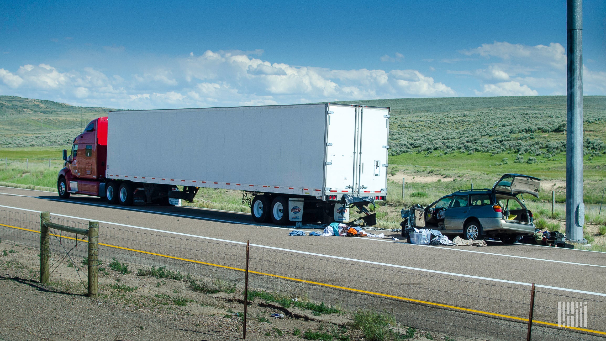 Truck and car involved in rear-end crash.