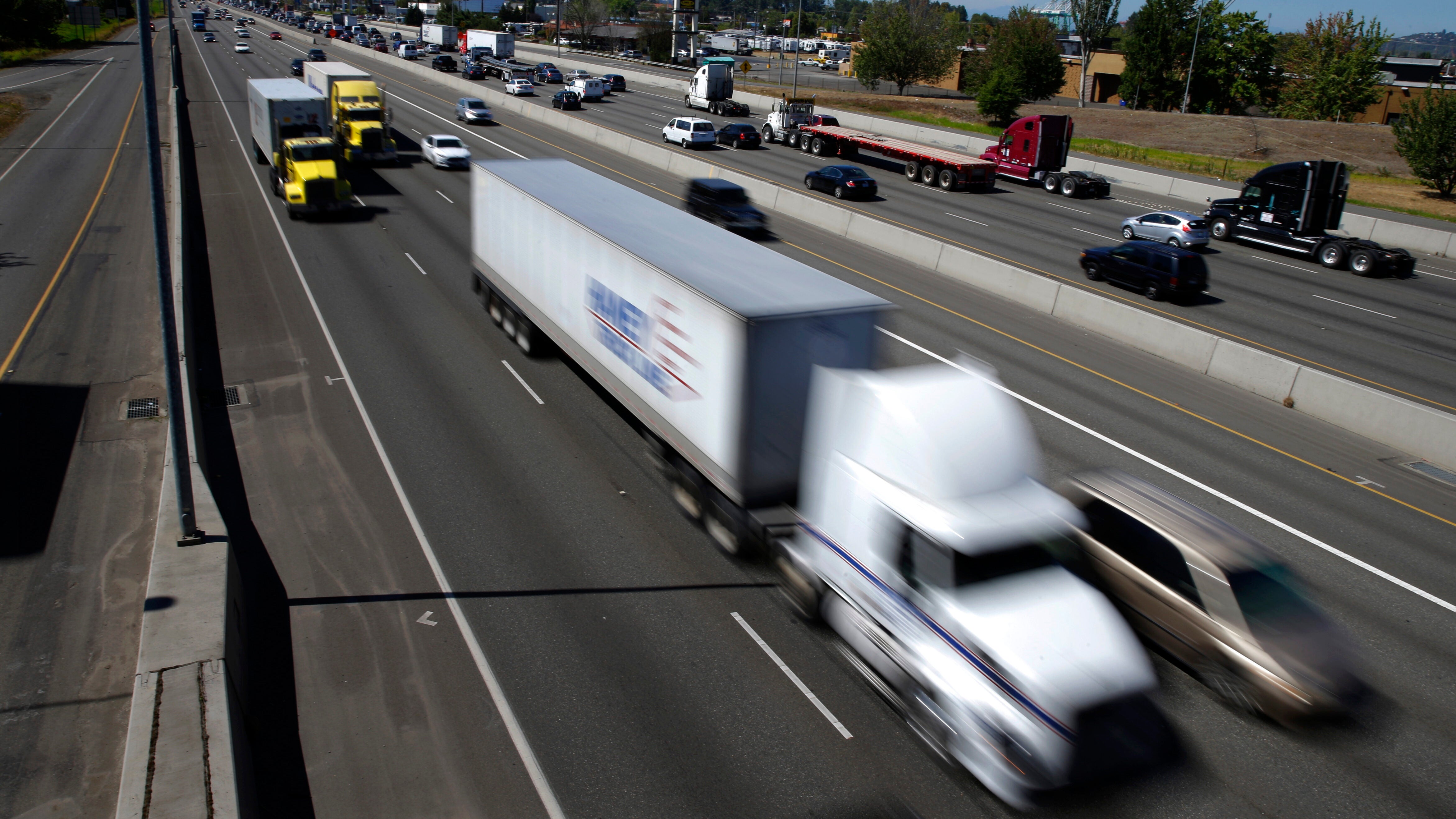 Trucks and cars on interstate.