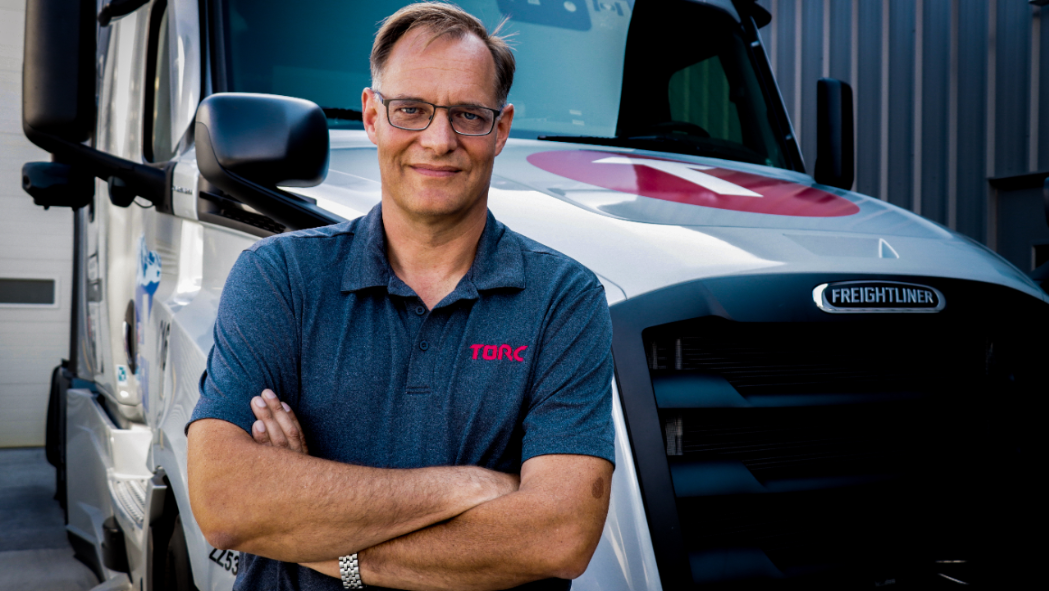 Peter Vaughan Schmidt with autonomous Freightliner Cascadia