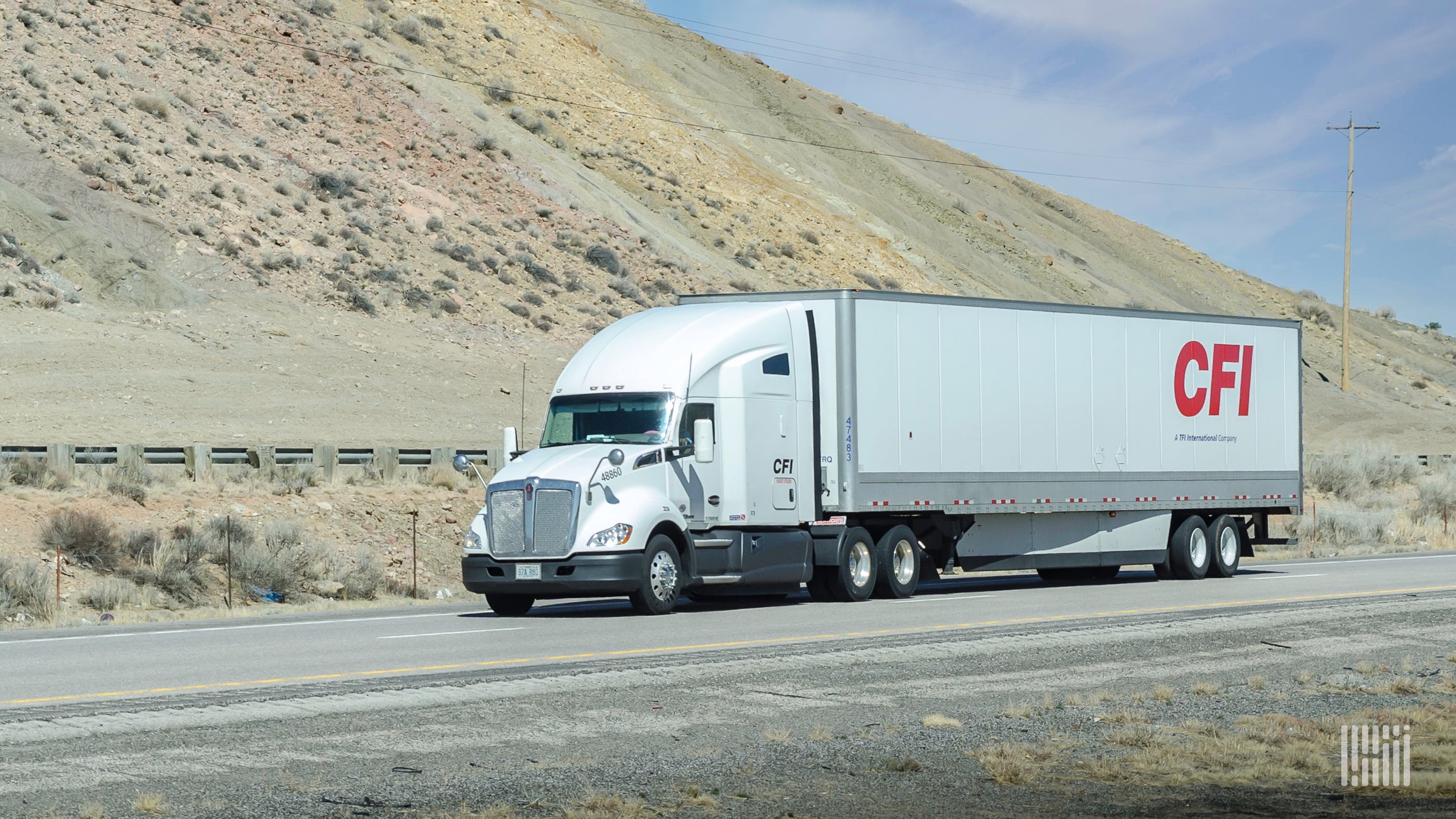 A white CFI tractor pulling a white CFI trailer