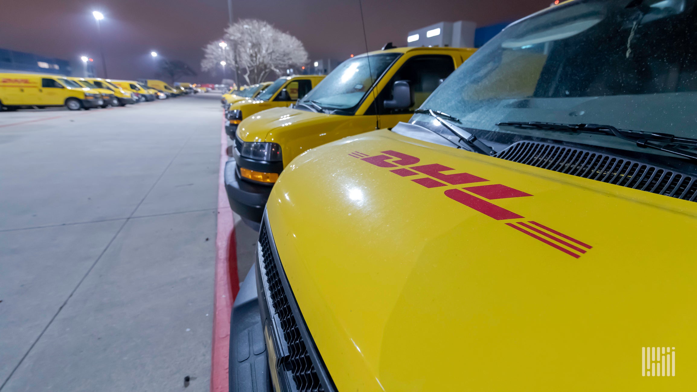 DHL delivery vans parked in a row