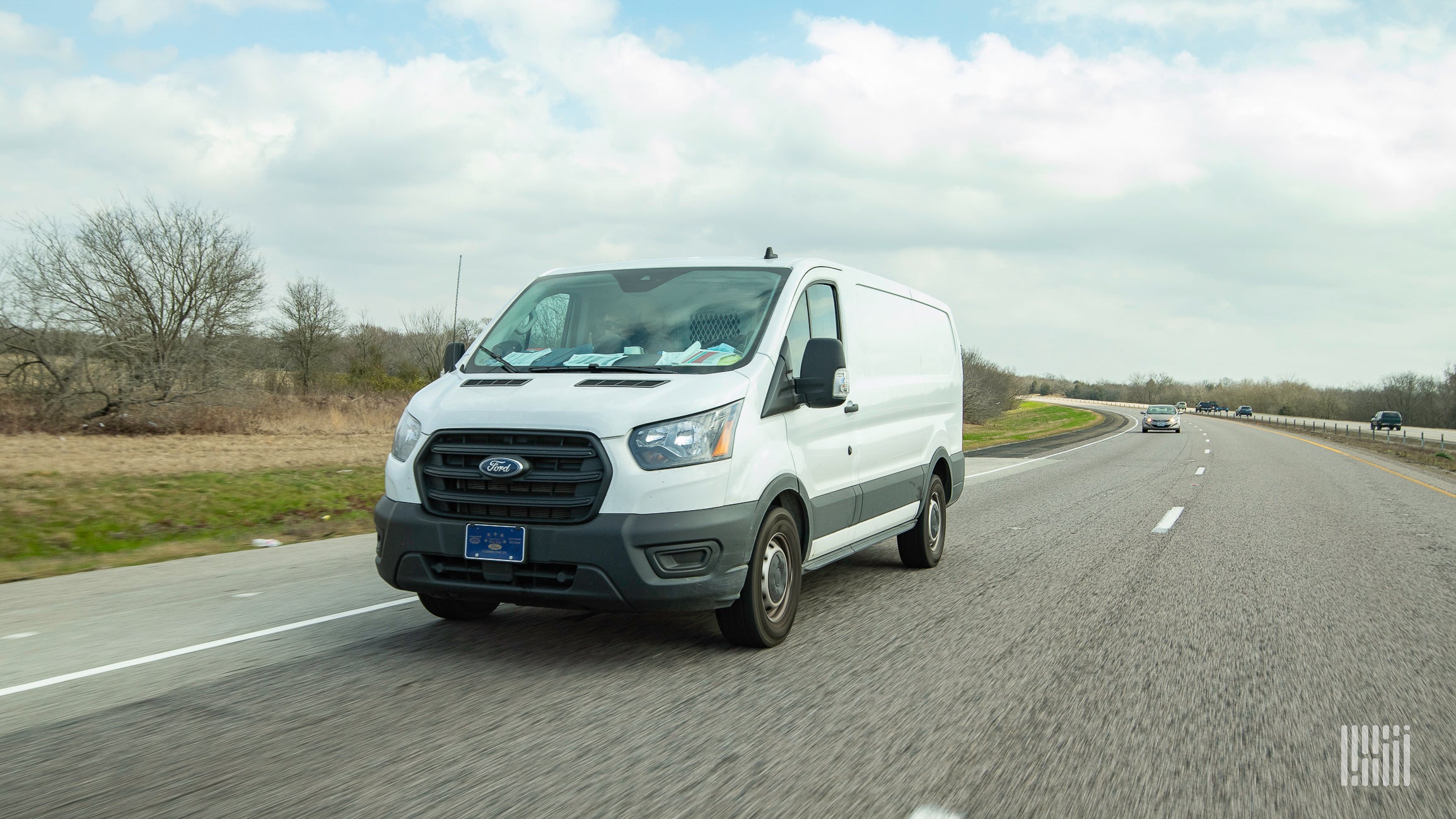 White delivery van on highway