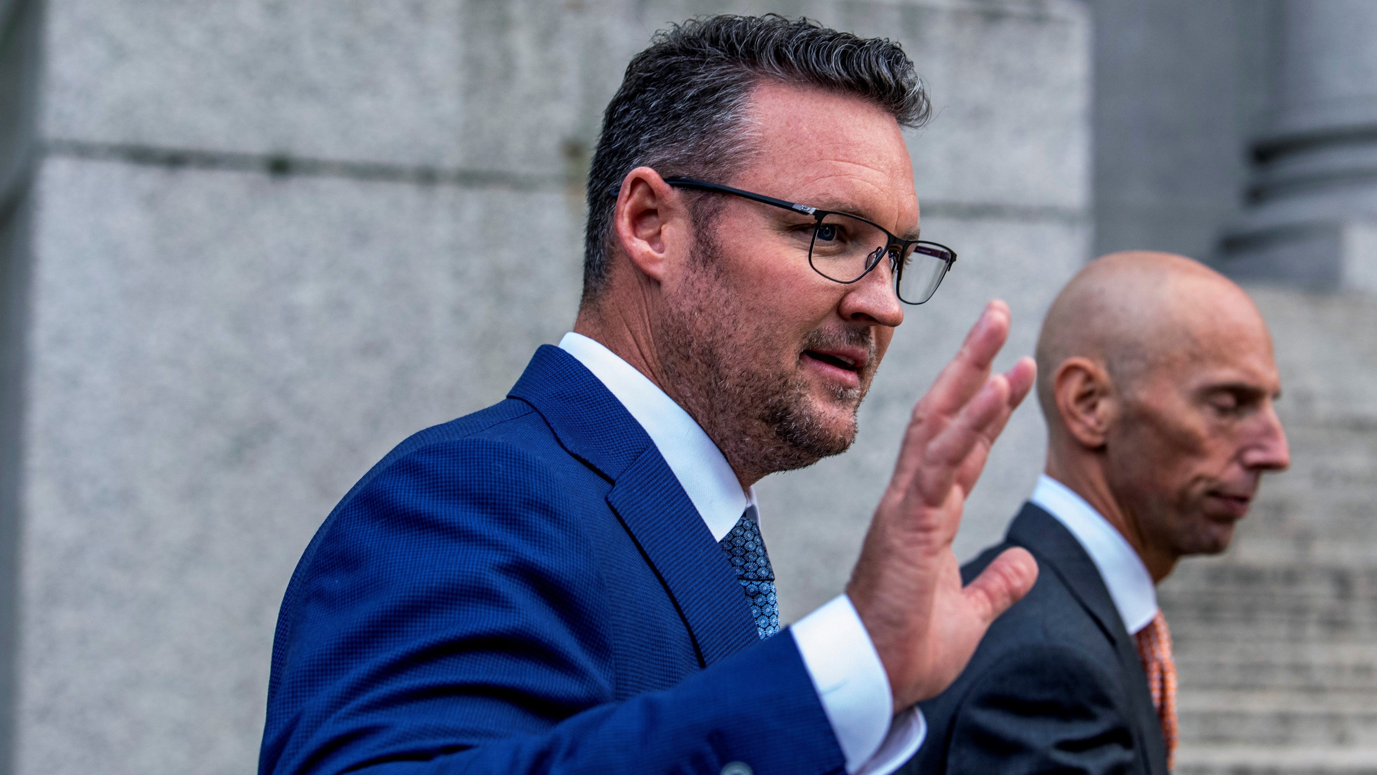 Trevor Milton gestures as he leaves U.S. District Court on Sept.12.