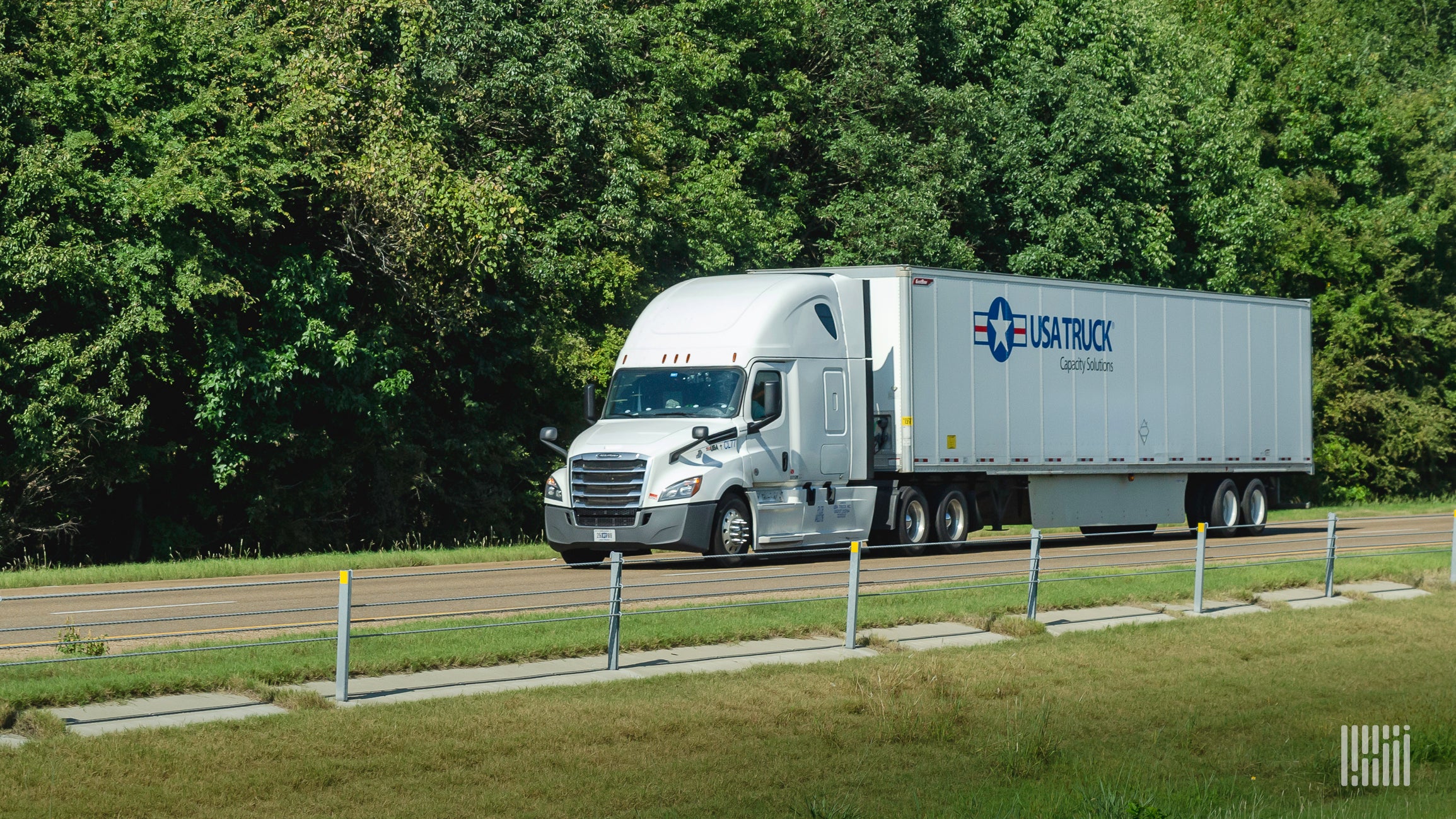 USA Truck tractor-trailer on highway