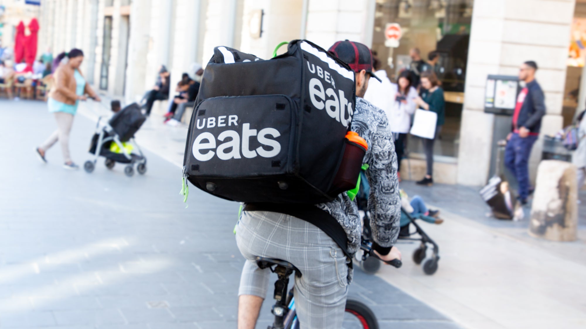 Uber Eats bike rider on city street in France