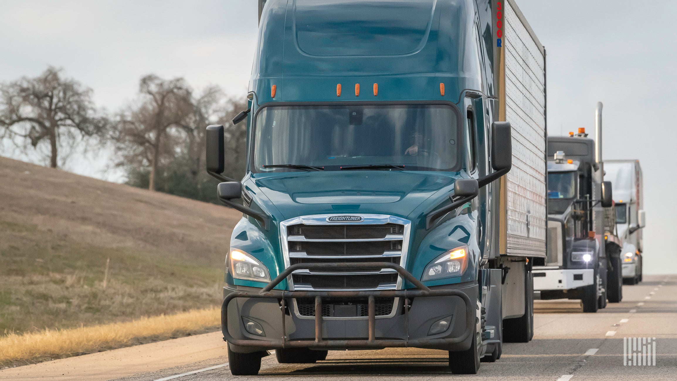 Multiple trucks on the highway