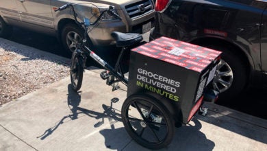 Gorillas delivery bike sits on the sidewalk