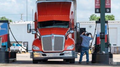 Driver with truck at service station