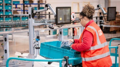 GXO worker filling orders in warehouse