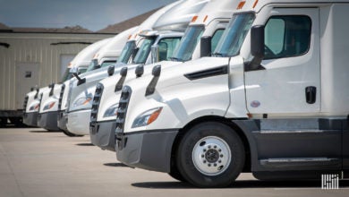 White trucks parked in a row