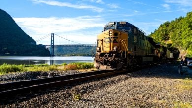 A CSX train passes by the Hudson River in New York.