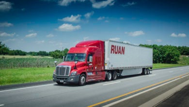 A red Ruan tractor and white trailer on the highway