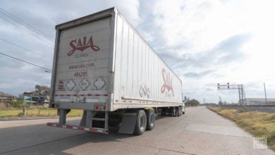 A Saia tractor-trailer approaching a railroad crossing