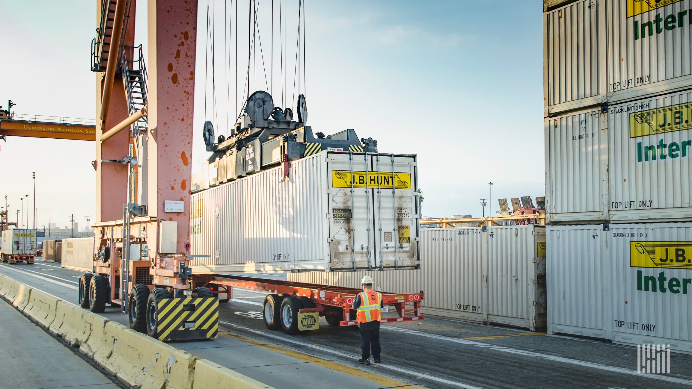 J.B. Hunt intermodal containers being lifted at port