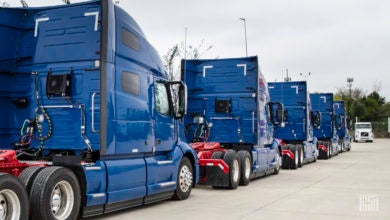 Blue Volvo tractors parked on a lot