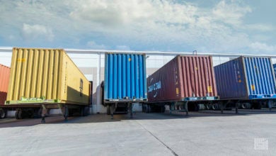 Containers on chassis at a warehouse