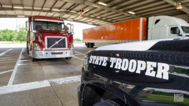 State trooper inspecting a truck