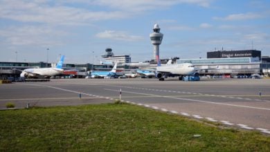 Aircraft on the tarmac at Schiphol Airport.