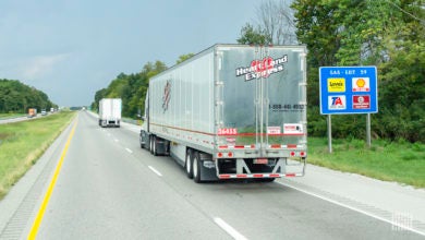 A Heartland Express tractor-trailer on the highway.