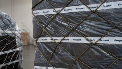 A pallet with black shrink wrap labeled Flexport.