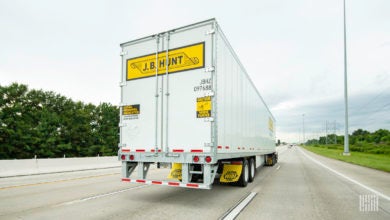 The back of a J.B. Hunt trailer on the highway