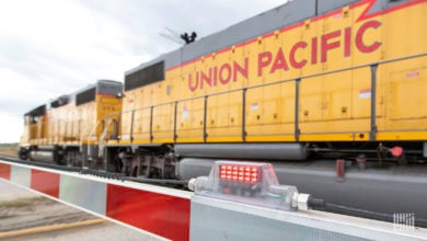 A Union Pacific train passes by a railroad crossing.