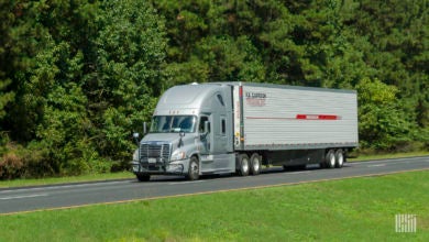 An R.E. Garrison tractor-trailer on the highway