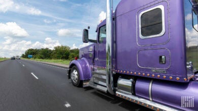 Purple truck on the highway