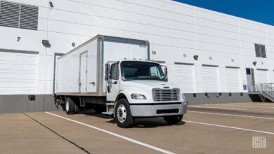 A white final-mile truck at a warehouse