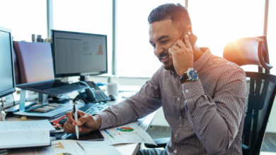 Man conducting virtual sales call at desk.