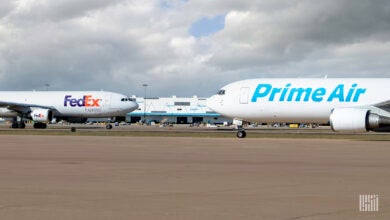 FedEx and Prime Air jets passing in opposite directions on taxiways.