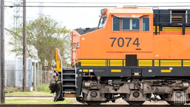 A BNSF locomotive travels down the train track.