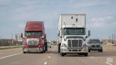 Trucks and cars on the road.