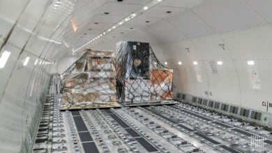 Interior of a Boeing 777 cargo jet with pallets.