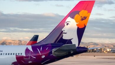 Close up of colorful tail on a Hawaiian Airlines plane.