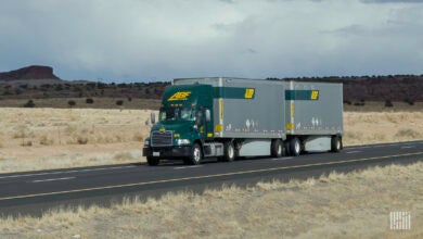 An ABF Freight tractor pulling LTL trailers on a highway