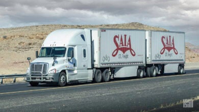 A third-party tractor pulling two Saia trailers on highway