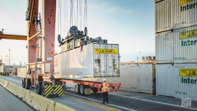 J.B. Hunt intermodal containers being lifted at a port