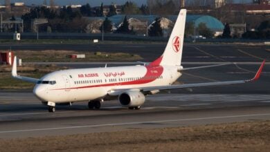 A white-and-red Air Algerie jet is set for departure.