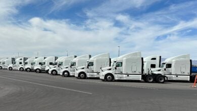 Row of white TuSimple trucks