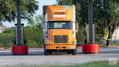 A Yellow rig at a fueling station