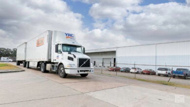 A YRC tractor with two LTL trailers